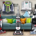A Collection Of Vacuums And Carpet Cleaners In A Living Room