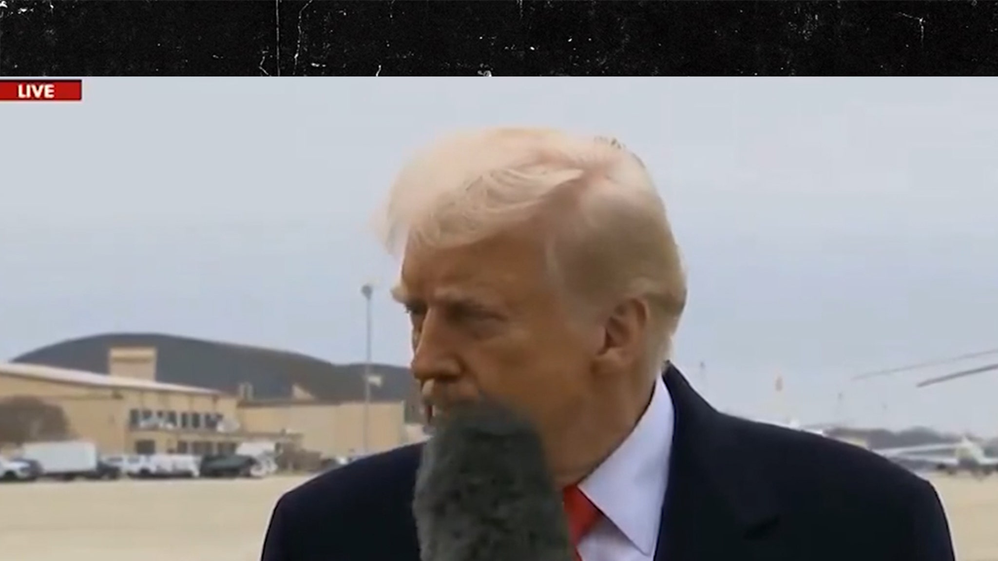 President Trump Hit In Face By Reporter's Microphone