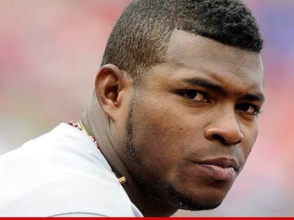 Dodgers' Yasiel Puig lets children give him a new hairdo for a