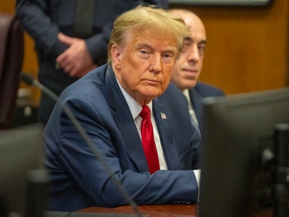 Donald Trump at counsel table in NY fraud case.