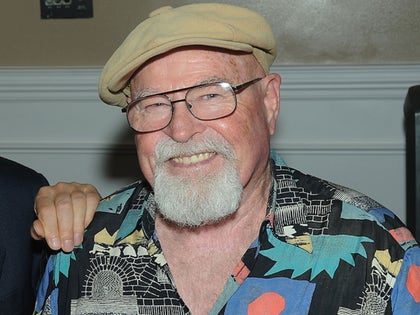 Charles Cyphers Smiling In A Colorful Shirt And Newsie Hat