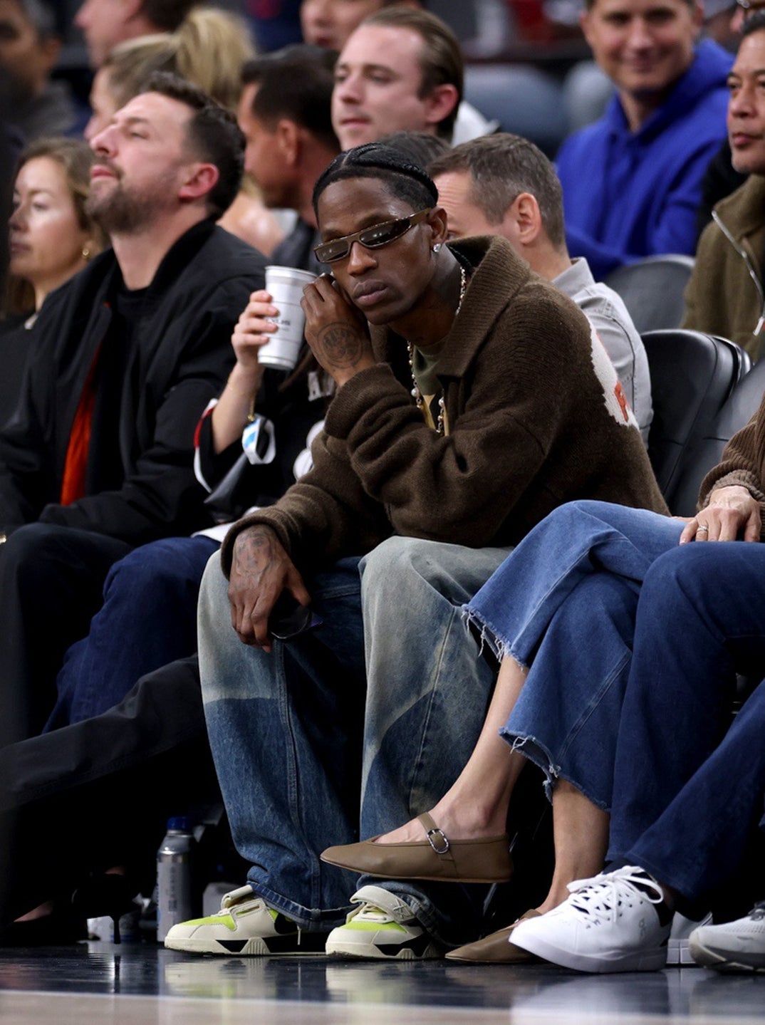 Travis Scott vibes out courtside during a 122-97 Los Angeles Lakers win over the LA Clippers at Intuit Dome on February 04, 2025 in Inglewood