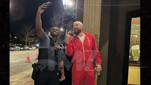 Travis Kelce Takes Photo at Restaurant with Cop After Kansas City Parade Shooting