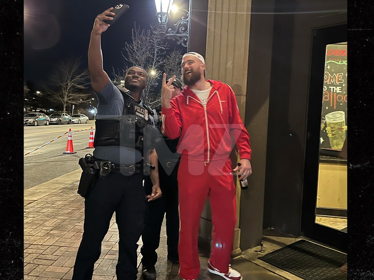 Travis Kelce Takes Picture With Cop After Parade