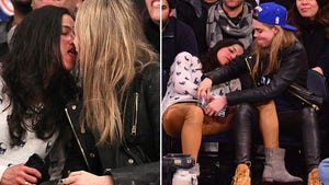 Michelle Rodriguez -- Drunken Courtside Party with Model Cara Delevingne