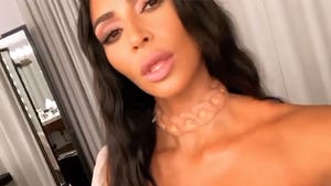 Kim Kardashian West Gets Temporary Glowing Alien Necklace Implanted Under Skin