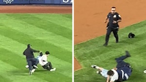 100825_baseball_fans_tackled_primary