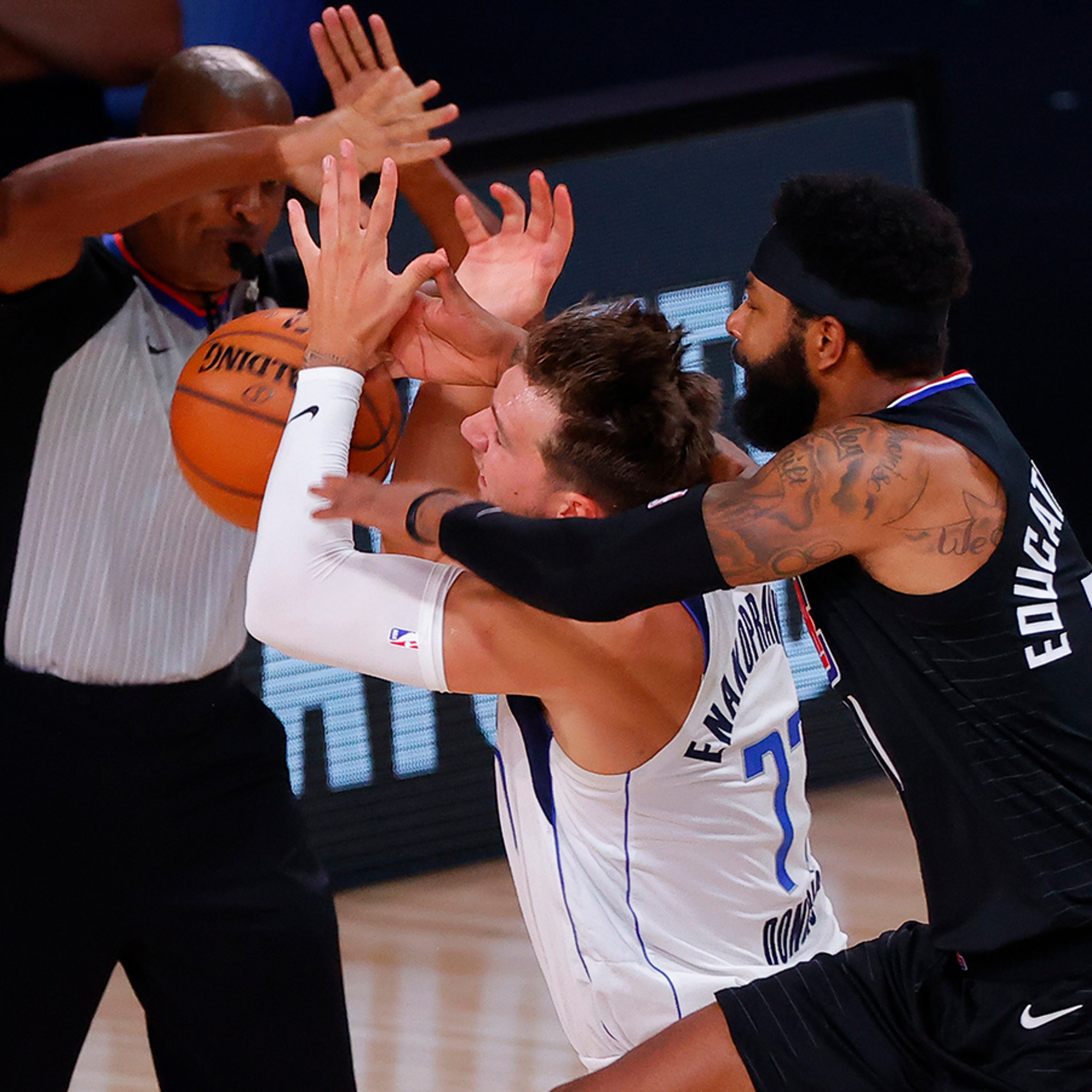 NBA fans in meltdown thinking Luka Doncic gets 'criminal' haircut while  playing chess at barber's - but there's a twist