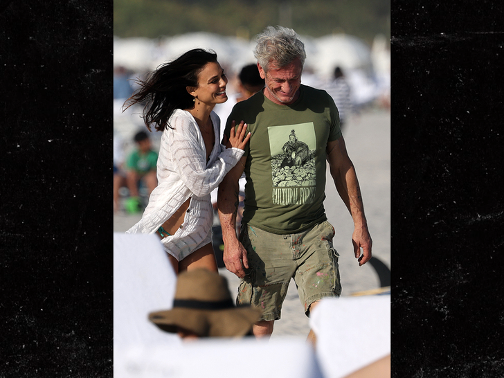 Sean Penn holds hands with  Nathalie Kelley