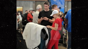 'Bachelor' Couple Arie and Lauren Spotted at Airport with Wedding Dress in Hand