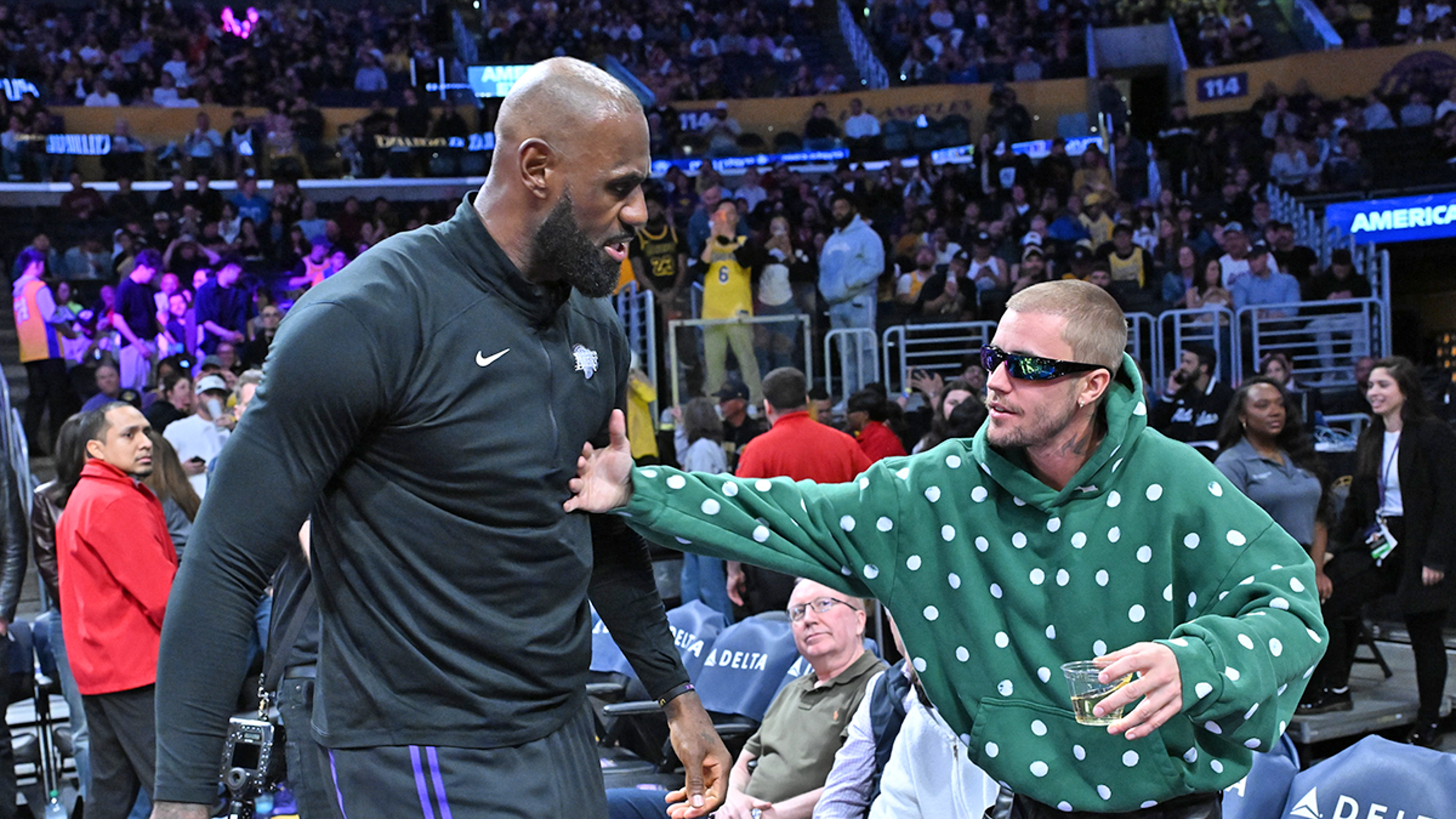 Justin Bieber Daps Up LeBron, Sips Drink Courtside At Lakers Game