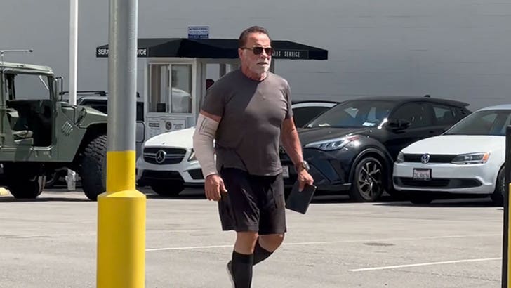 Arnold Schwarzenegger Sporting Arm Forged After Present process Elbow Surgical procedure