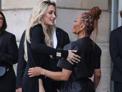 Janet and Paris Jackson hugging at fashion week getty 3