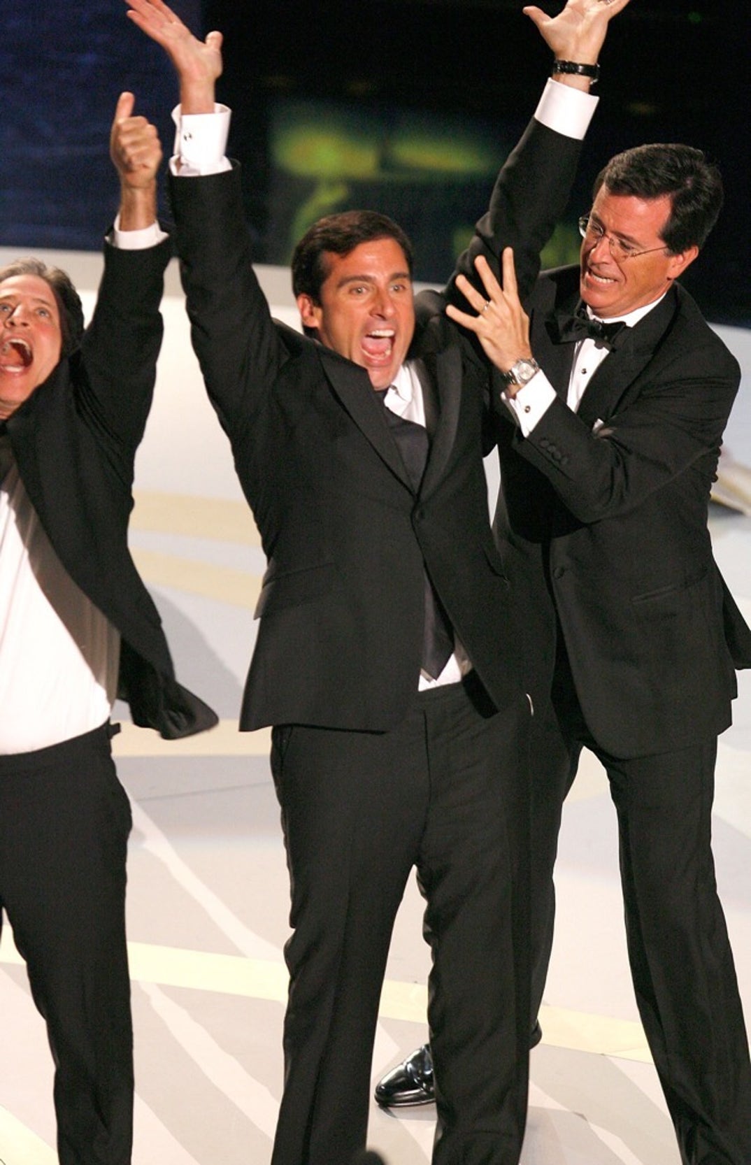 Jon Stewart, Steve Carell, and Stephen Colbert celebrate onstage -- 59th Annual Primetime Emmy Awards