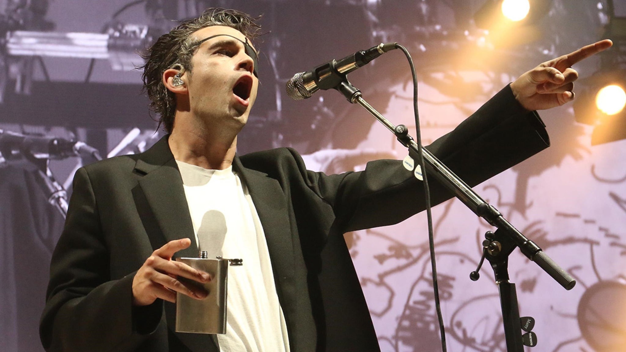 Matty Healy drank from a flask on stage after breaking up with Taylor Swift