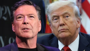 James Comey is seen standing next to Donald Trump. Comey's wearing a black shirt and a matching jacket, while Trump's wearing a blue jacket, white shirt, and a red tie.