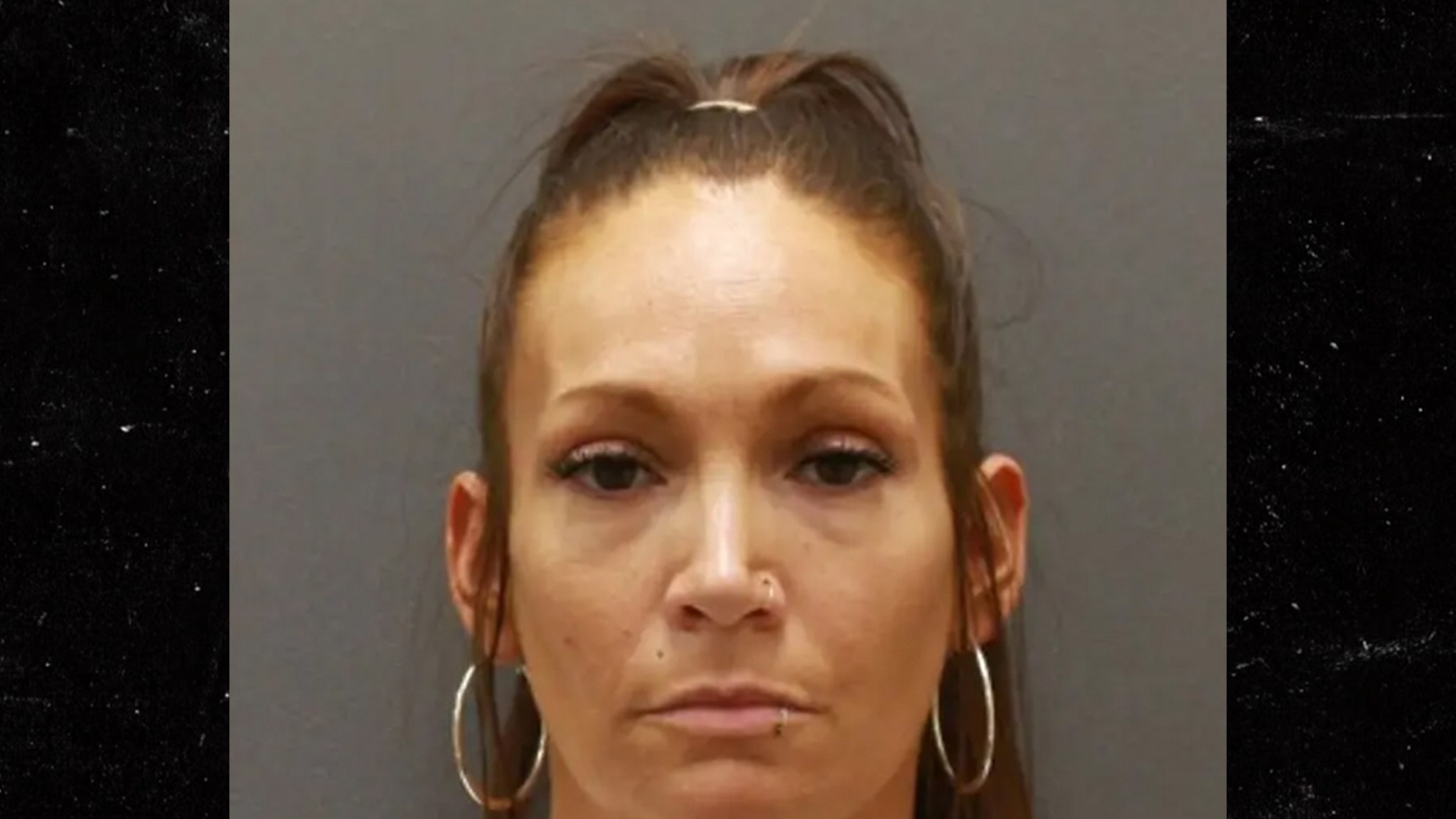 Jennifer Lopez Doppelganger Poses for Mug Shot After Theft Arrest