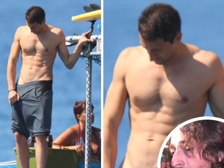 Looking ripped and buff, Adrien Brody adjusted himself while on a boat in H...