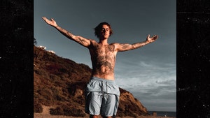 Justin Bieber Spreads Out on the Beach for Biblical Photo