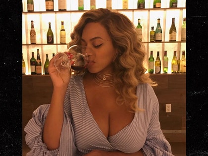 0804-beyonce-showing-cleavage-drinking-INSTAGRAM-01