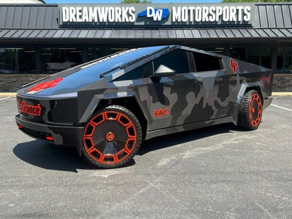 Tesla Cybertruck With Camo Paint And Big Red Rims