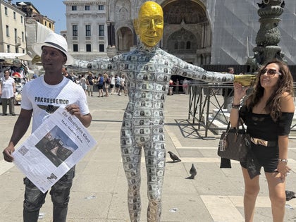 0624-Bezos-Money-Statue-PRIMARY