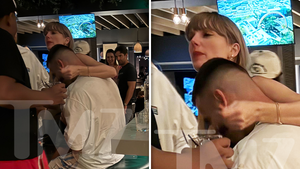 Taylor Swift Wraps Arm Around Travis Kelce's Neck in First PDA Photo