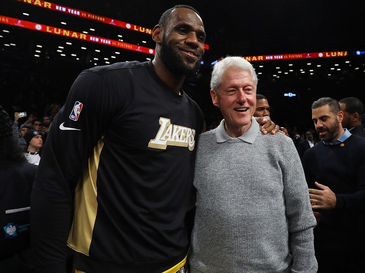 Bill Clinton at Lakers vs. Nets Game Photos