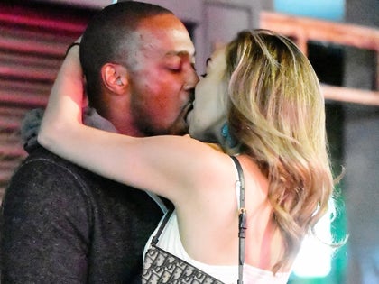 0813-Anthony-Mackie-Kissing-Woman-PRIMARY