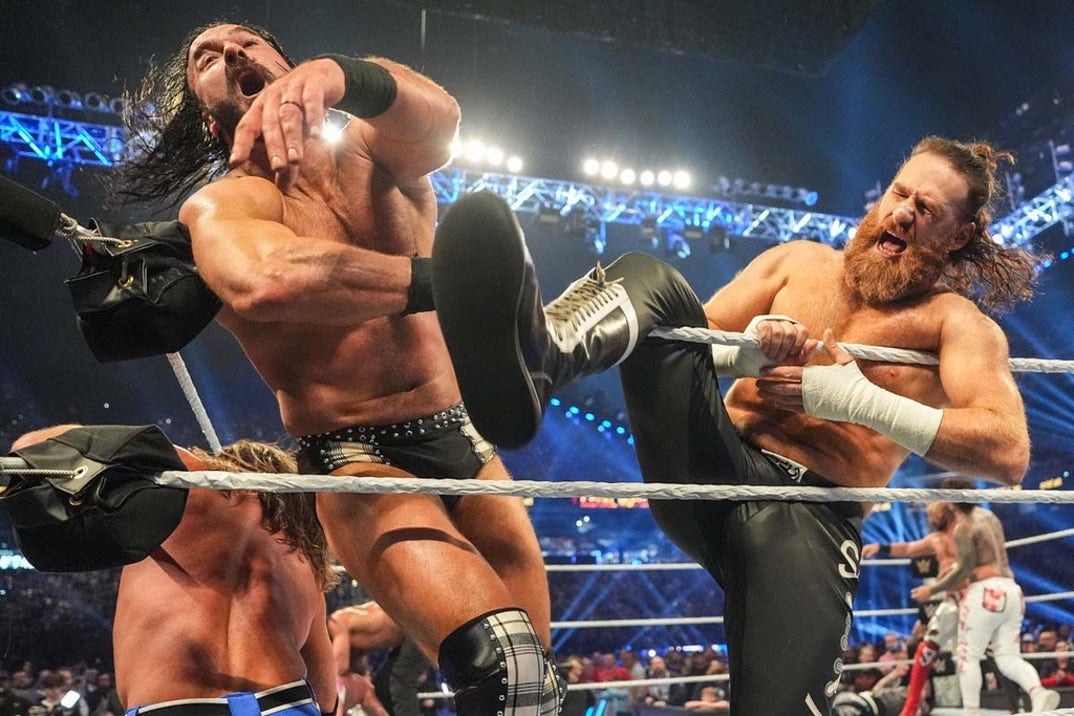 Sami Zayn hits Drew McIntyre with a Helluva Kick