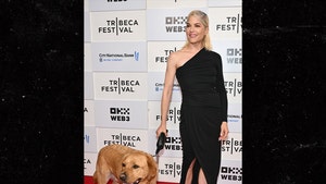 selma blair and dog on red carpet