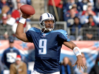 Steve Mcnair Playing On The Field For The NFL photos 1