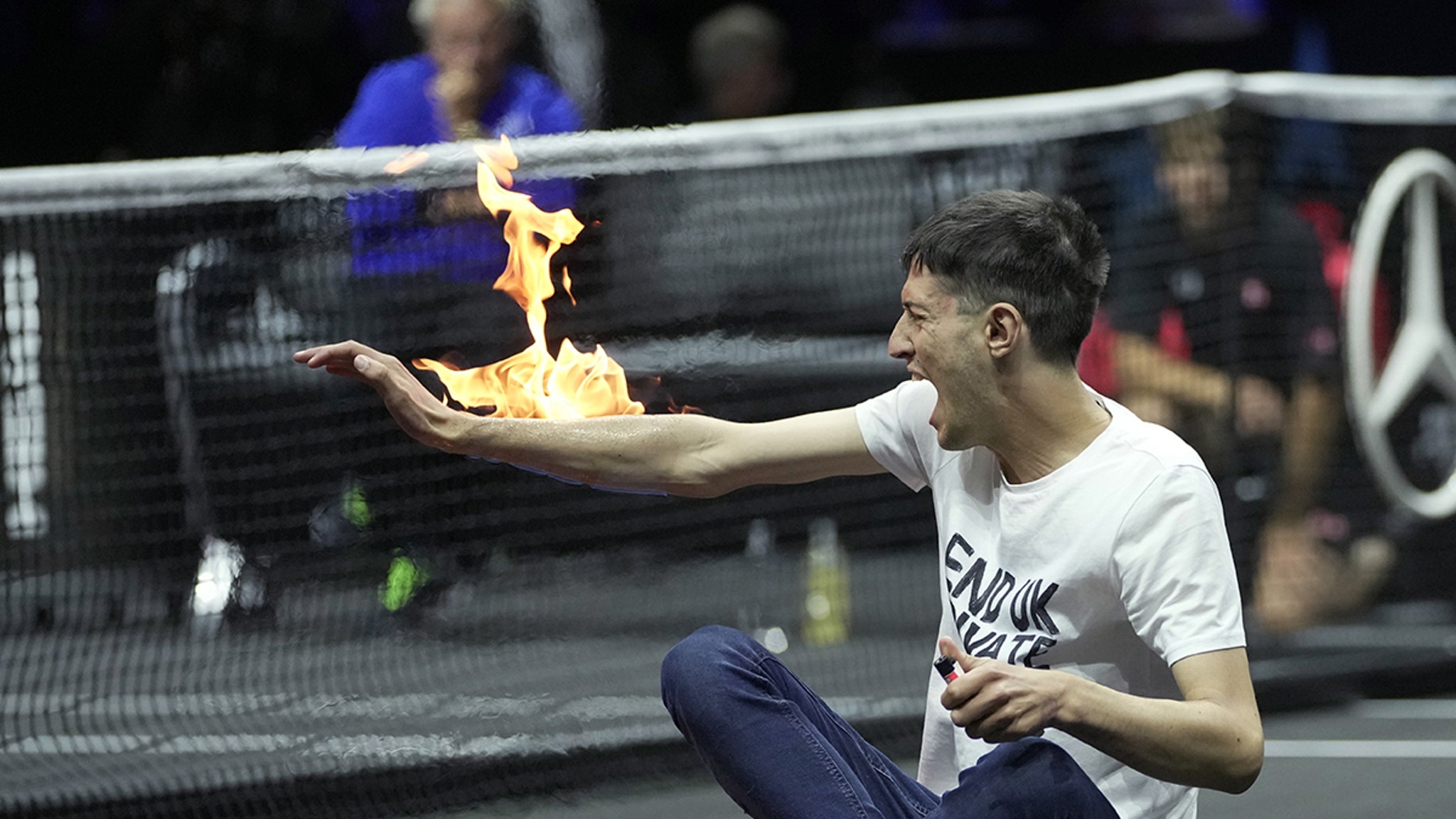 Protester Sets Arm On Fire In Wild Scene At Roger Federer’s Last Tournament