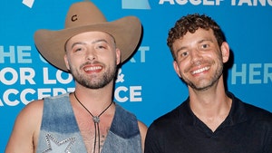 adam_mac_with_his_husband_lee_pfund_getty_1_720