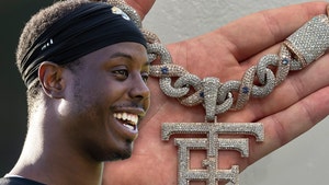 NFL's Travis Etienne Cops 60-Carat Diamond Logo Chain