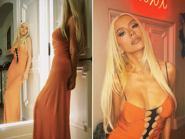 Christina Aguilera Shines in an Orange & Black Halloween Outfit