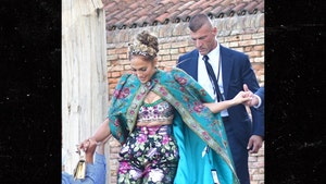 J Lo Flashes Price Tag on Dolce & Gabbana Cape Worn for Fashion Show