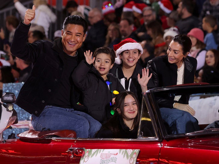 Celebs Attend The Hollywood Christmas Parade