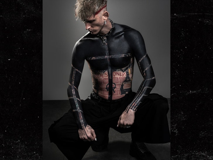 Machine Gun Kelly Covers Most of His Tattoos With Black Ink - XXL
