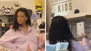 Rihanna Shops for Baby Clothes and Shows Off Baby Bump