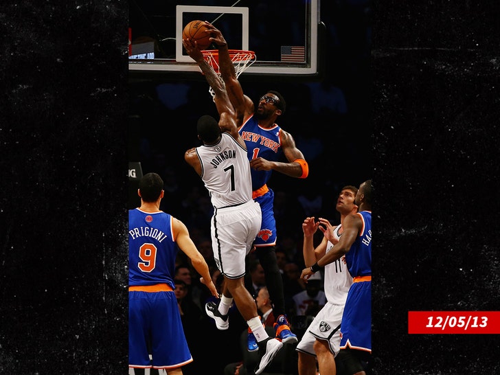 Amar'e Stoudemire #1 of the New York Knicks blocks a shot by Joe Johnson getty