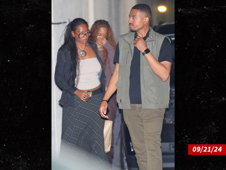 Sasha and Malia Obama on Saturday night, September 25, 2024, in a Hollywood, California alley next to a secret service officer.