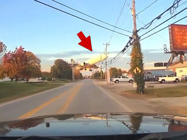 UPS plane flies low over Kentucky road