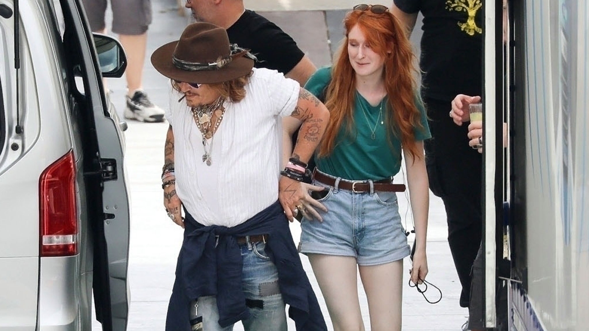 Johnny Depp Continues Music Gigs in Italy, With Cute Red-Head in Tow thumbnail