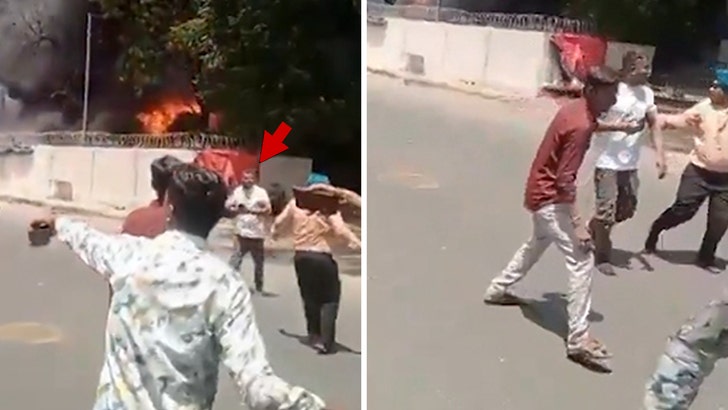 Indian Jet Crash’s Sole Survivor Seen on Phone Walking Away From Wreck, New Video Indian Jet Crash’s Sole Survivor Seen on Phone Walking Away From Wreck, New Video