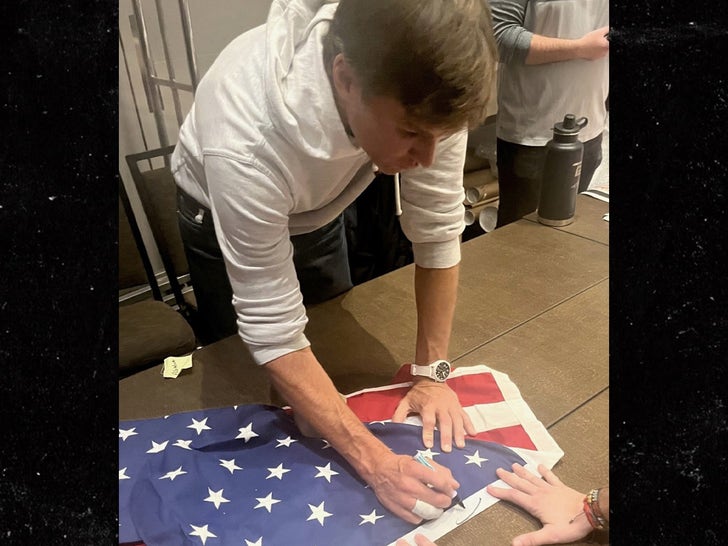 Tom Brady Signing A Flag