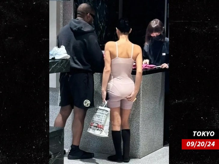 kanye and bianca on street in tokyo