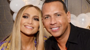 Jennifer Lopez and Alex Rodriguez Engaged, Celebrate on Bed of Roses